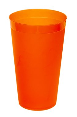 Orange plastic glass for juice, isolated on white background